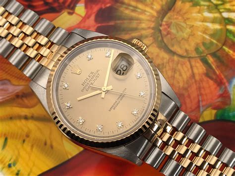 rolex oyster perpetual date gold stainless